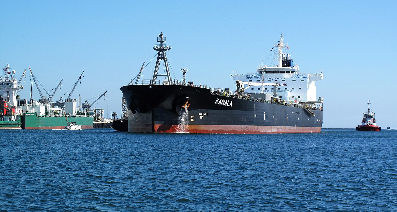 The oil-products tanker Kanala enters the Port of Los Angeles with a tug nearby.